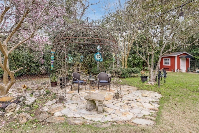 818 Watt Dr, Tallahassee, FL 32303 - view of yard with a shed, an outdoor structure, and a patio
