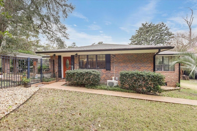 818 Watt Dr, Tallahassee, FL 32303 - ranch-style home with fence, a front lawn, and brick siding