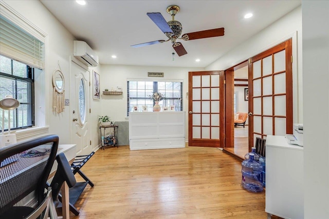 818 Watt Dr, Tallahassee, FL 32303 - interior space featuring a wall unit AC, light wood-type flooring, ceiling fan, and recessed lighting