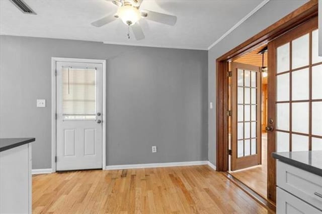 entryway with visible vents, light wood-type flooring, and a wealth of natural light