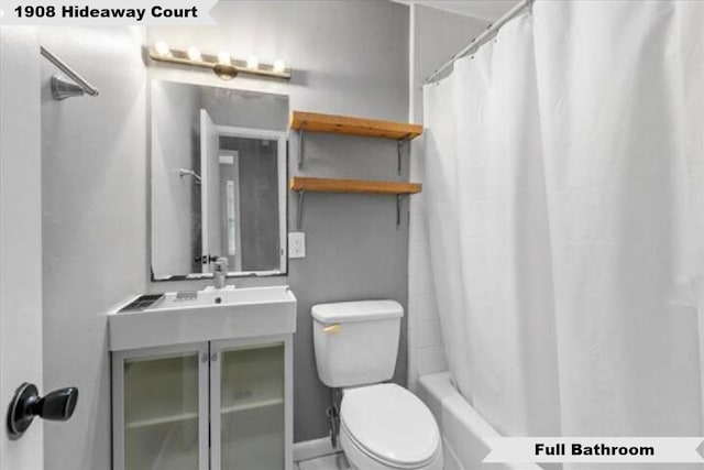 bathroom with toilet and vanity