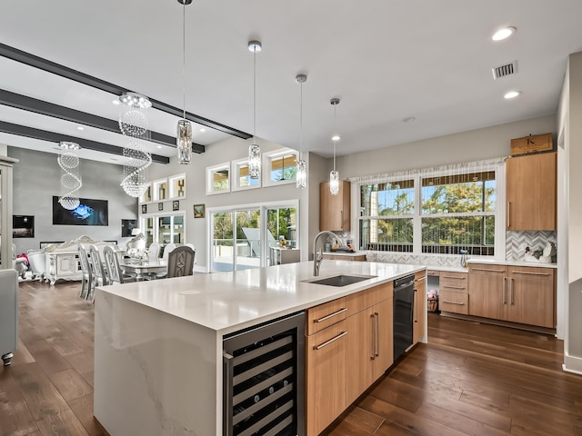 kitchen featuring sink, dark hardwood / wood-style floors, decorative backsplash, decorative light fixtures, and beverage cooler