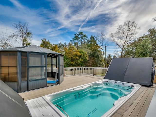 view of swimming pool featuring a wooden deck