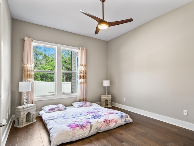 bedroom featuring ceiling fan and dark hardwood / wood-style flooring