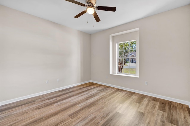 spare room with ceiling fan and light hardwood / wood-style flooring