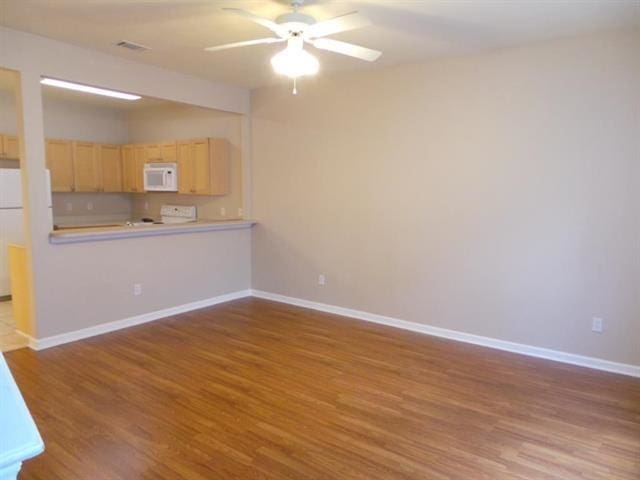 unfurnished living room featuring light hardwood / wood-style floors and ceiling fan