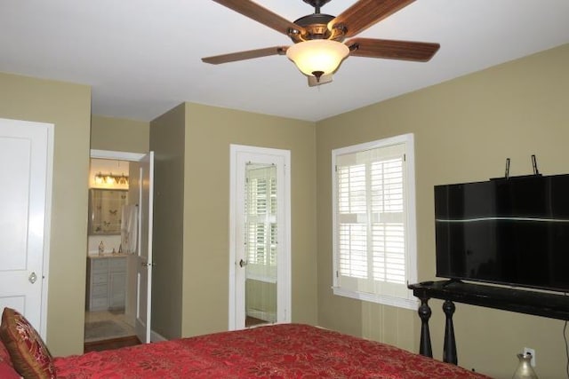 bedroom with ceiling fan and connected bathroom