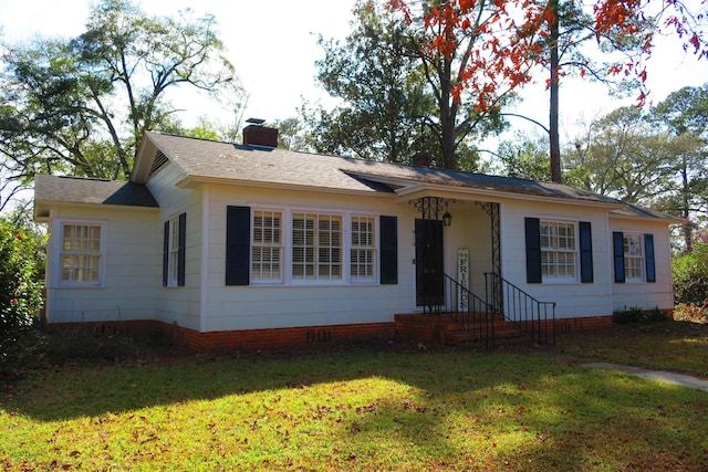 ranch-style home featuring a front yard