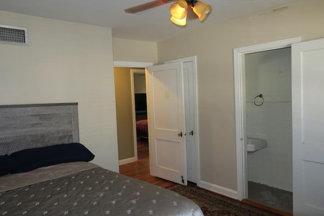 bedroom featuring ceiling fan and dark hardwood / wood-style flooring