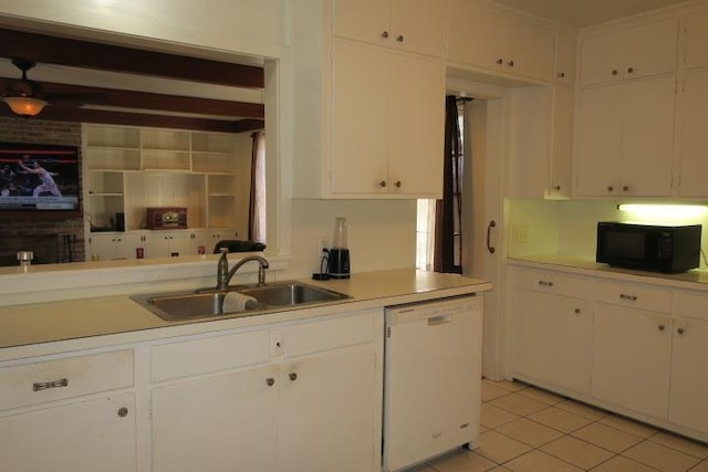 kitchen with sink, light tile patterned floors, white cabinetry, and dishwasher