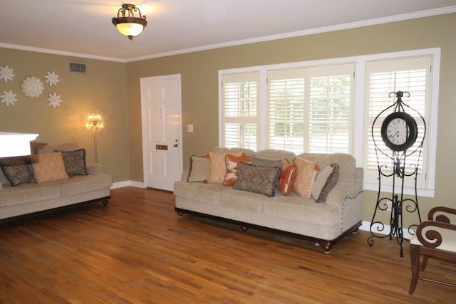 living room featuring hardwood / wood-style flooring and crown molding