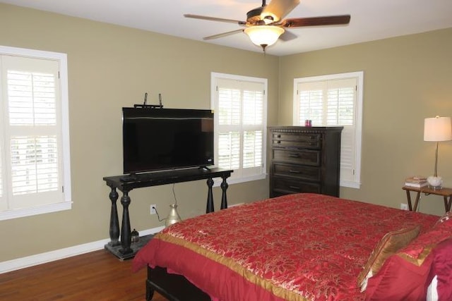 bedroom with dark wood-type flooring and ceiling fan