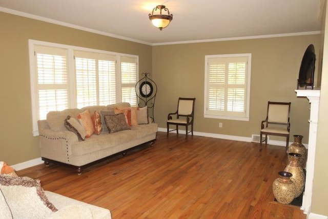 living room featuring hardwood / wood-style flooring and crown molding