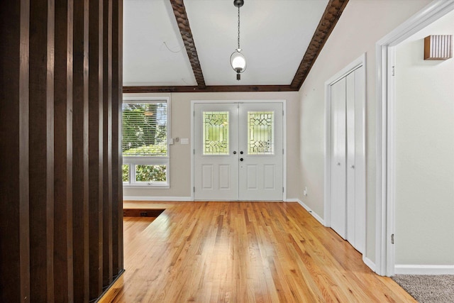 2521 Harriman Cir, Tallahassee, FL 32308 - foyer entrance with beamed ceiling and light wood-style flooring