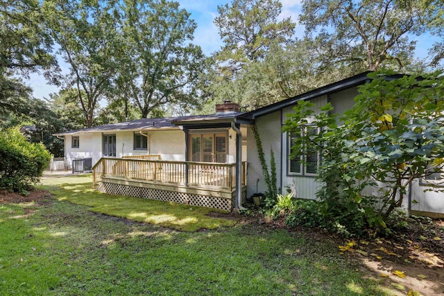 2521 Harriman Cir, Tallahassee, FL 32308 - view of property exterior with a lawn, a chimney, and a wooden deck