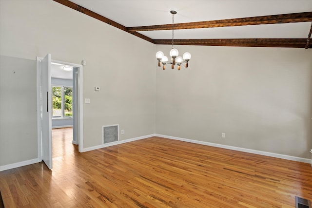 2521 Harriman Cir, Tallahassee, FL 32308 - empty room featuring light wood-type flooring, a chandelier, and beam ceiling