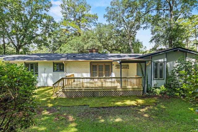 2521 Harriman Cir, Tallahassee, FL 32308 - rear view of house featuring a yard, a wooden deck, and a chimney