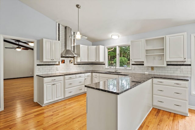 2521 Harriman Cir, Tallahassee, FL 32308 - kitchen with white cabinets, open shelves, light wood-style flooring, backsplash, and lofted ceiling