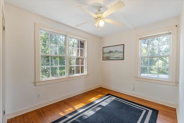 unfurnished room featuring hardwood / wood-style flooring and ceiling fan