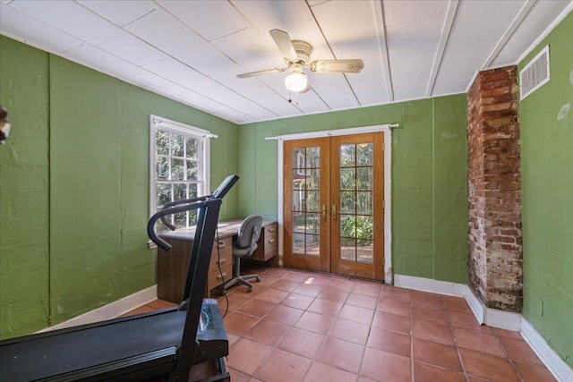 workout area featuring ceiling fan, french doors, tile patterned flooring, and a healthy amount of sunlight