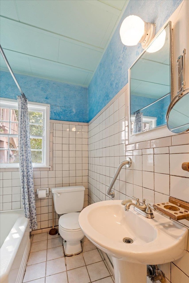 727 Miccosukee Rd, Tallahassee, FL 32308 - bathroom with toilet, tile walls, tile patterned flooring, shower / bath combo with shower curtain, and a sink