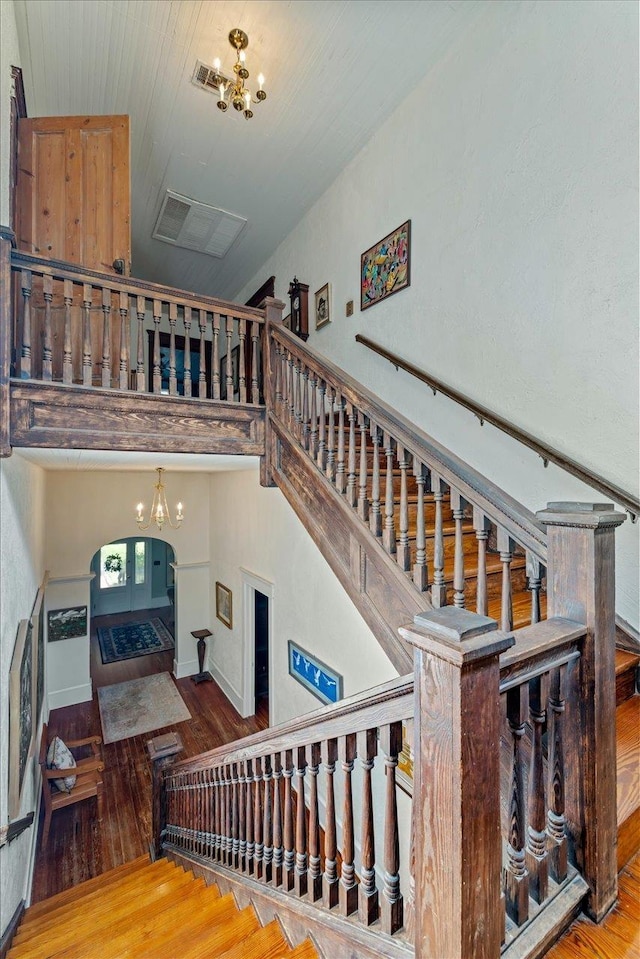 727 Miccosukee Rd, Tallahassee, FL 32308 - stairway featuring a chandelier and wood-type flooring