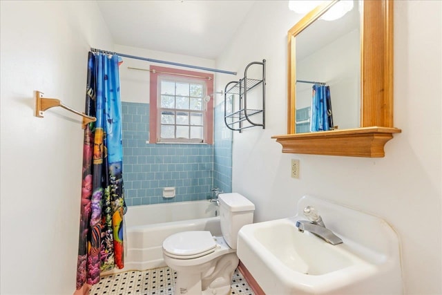 full bathroom with shower / bathtub combination with curtain, sink, and toilet