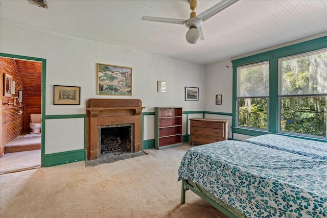 bedroom with light carpet and ceiling fan