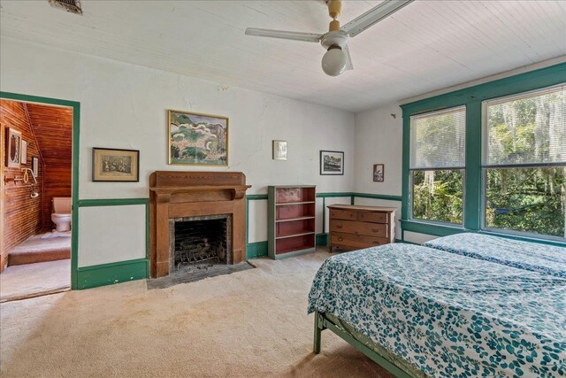 727 Miccosukee Rd, Tallahassee, FL 32308 - bedroom with light colored carpet, a fireplace with flush hearth, and ceiling fan
