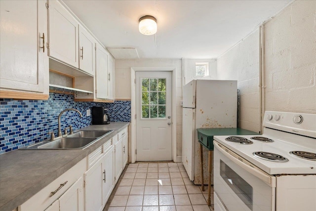 kitchen with white cabinetry, white appliances, sink, and light tile patterned floors