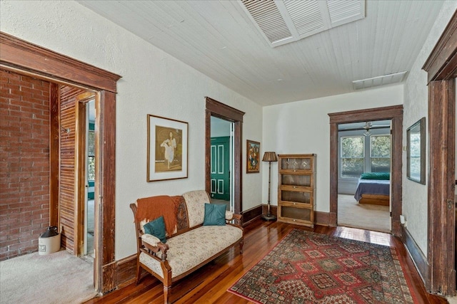 living area with dark hardwood / wood-style floors