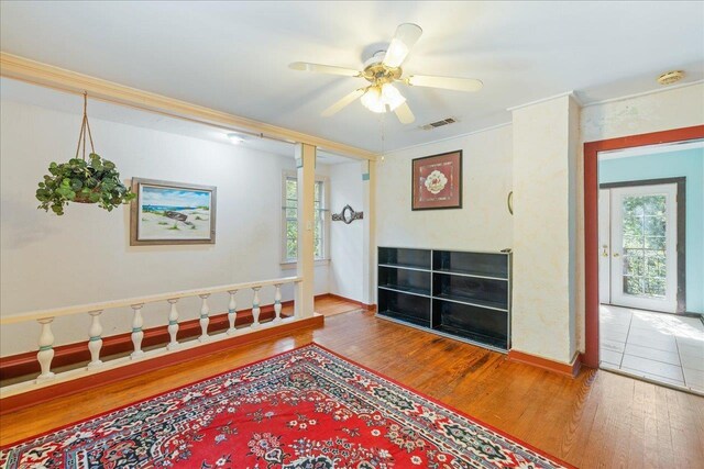 727 Miccosukee Rd, Tallahassee, FL 32308 - entryway with healthy amount of natural light, wood finished floors, baseboards, ceiling fan, and ornamental molding