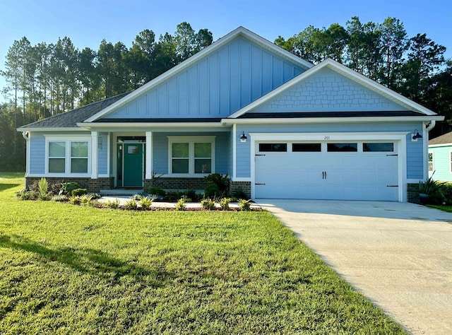 craftsman house featuring driveway, an attached garage, brick siding, and a front yard