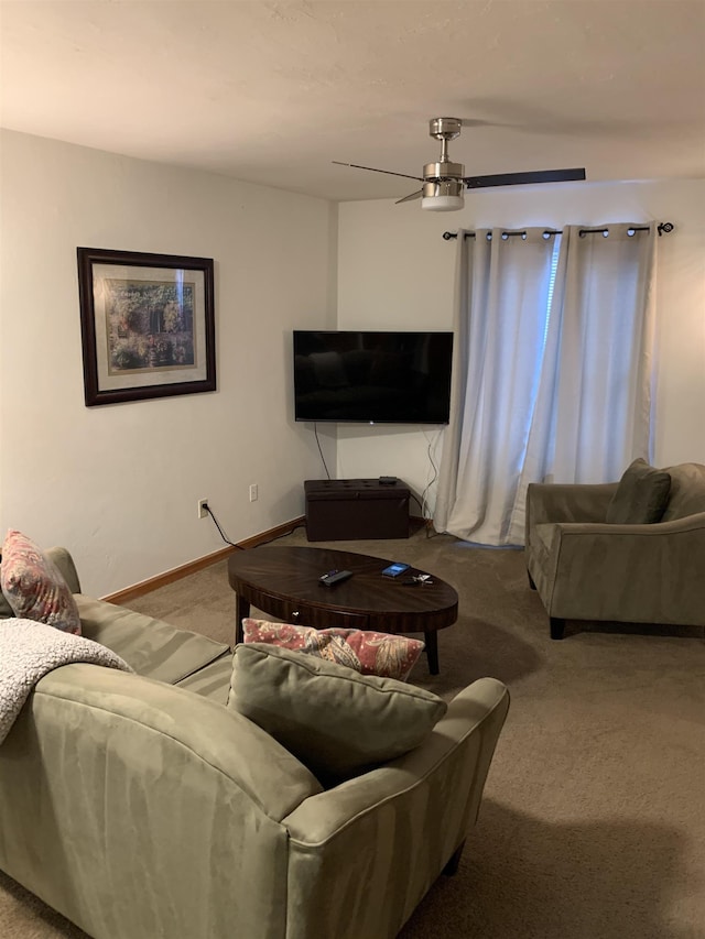 carpeted living room featuring ceiling fan