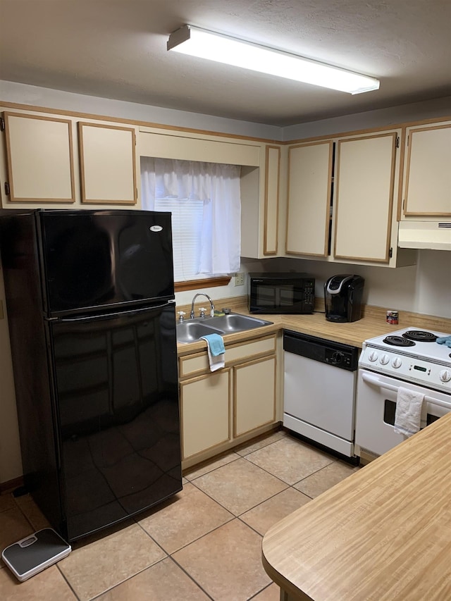 kitchen featuring exhaust hood, sink, black appliances, and cream cabinetry