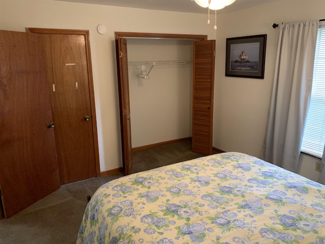 bedroom with dark carpet and a closet