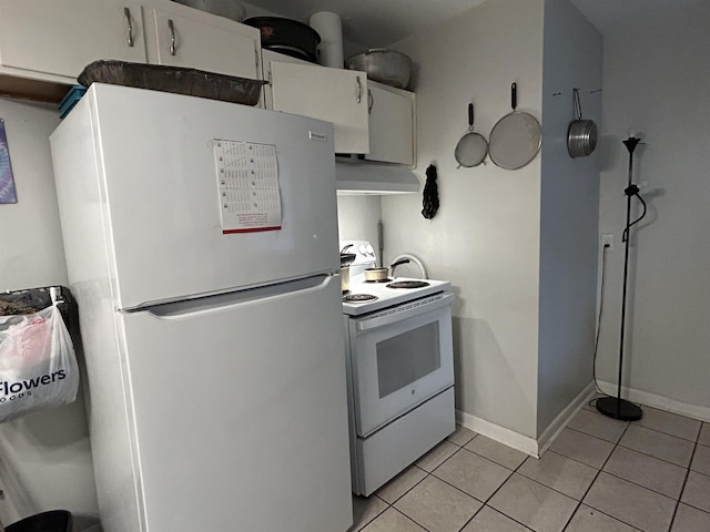 1518 Mabry St, Tallahassee, FL 32310 - kitchen featuring white appliances, baseboards, under cabinet range hood, white cabinets, and light tile patterned floors