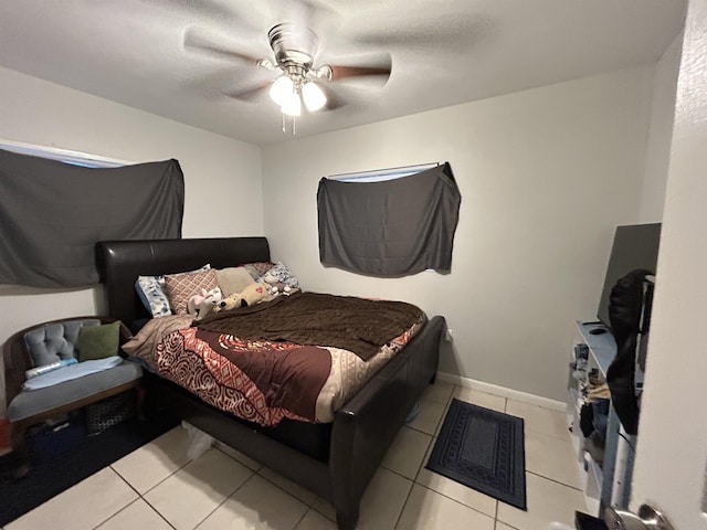 1518 Mabry St, Tallahassee, FL 32310 - bedroom with baseboards, tile patterned floors, and ceiling fan