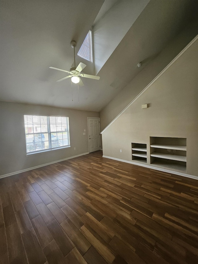 unfurnished living room featuring high vaulted ceiling, dark hardwood / wood-style floors, and ceiling fan