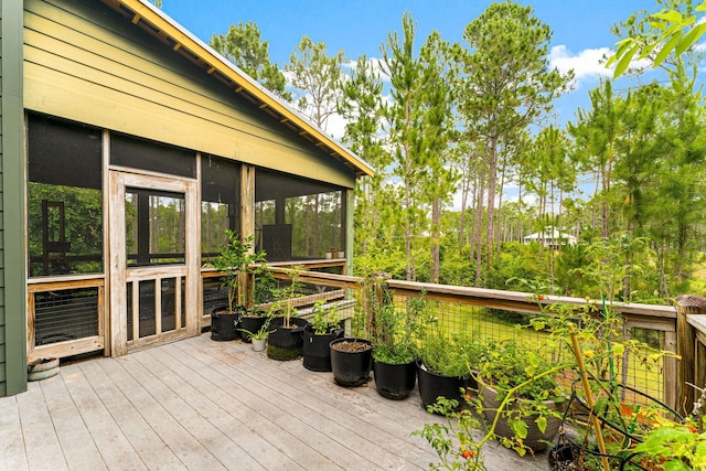 deck with a sunroom