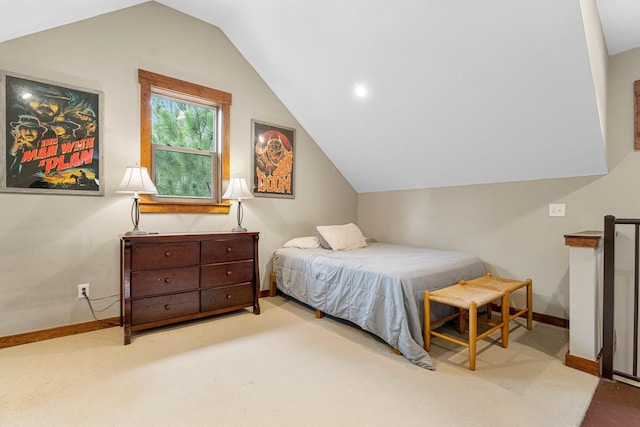 bedroom with lofted ceiling, baseboards, and carpet flooring