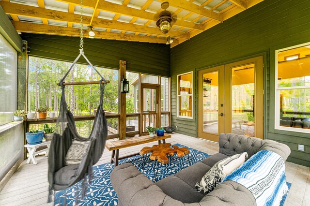 sunroom / solarium with french doors, beamed ceiling, a ceiling fan, and a healthy amount of sunlight