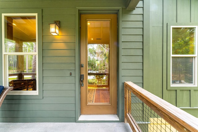 property entrance with board and batten siding