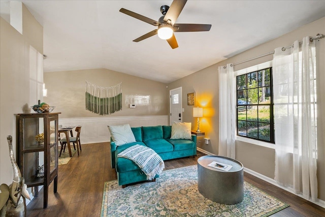 living room with lofted ceiling, dark wood-type flooring, and ceiling fan