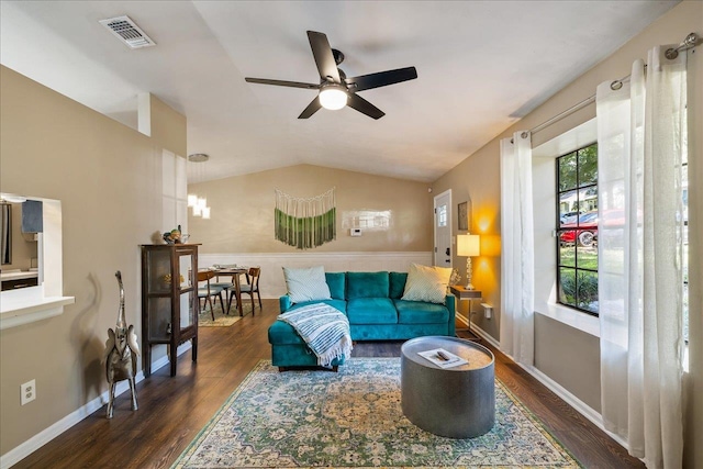 living room featuring ceiling fan, vaulted ceiling, and dark hardwood / wood-style floors