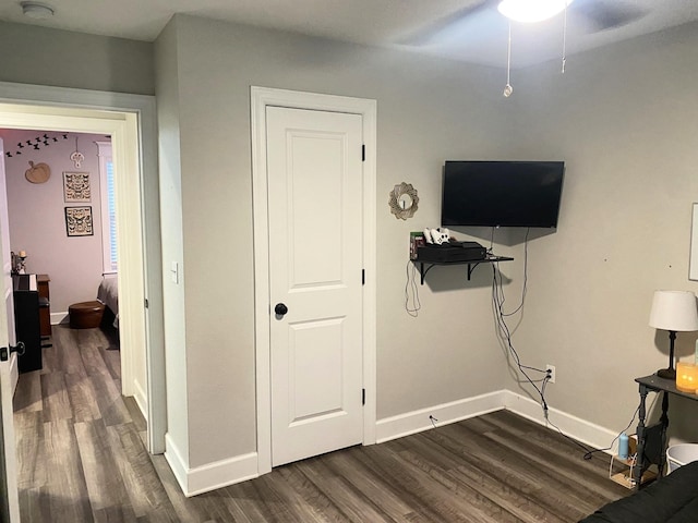 bedroom with ceiling fan and dark hardwood / wood-style floors