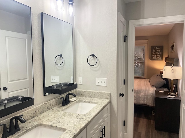 bathroom featuring hardwood / wood-style flooring and vanity