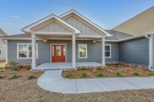 60 Sierra Ln, Crawfordville, FL 32327 - view of exterior entry with covered porch, roof with shingles, and board and batten siding