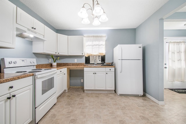 kitchen with sink, an inviting chandelier, white cabinets, and white appliances