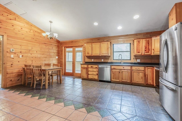 kitchen featuring hanging light fixtures, sink, a healthy amount of sunlight, and appliances with stainless steel finishes